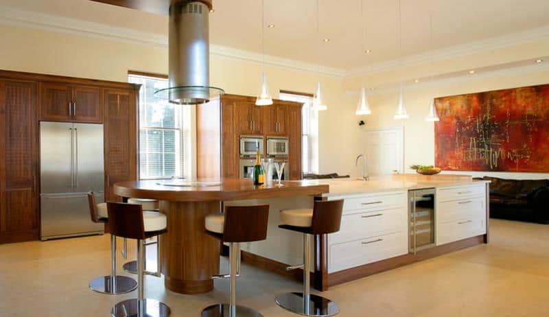 A modern kitchen that creates a fine line between contemporary design traits and mid-century aesthetics.