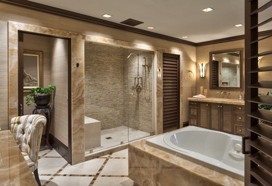 This luxurious bathroom again features a Jacuzzi tub and a beautiful accent-walled shower area separated by a glass wall. 