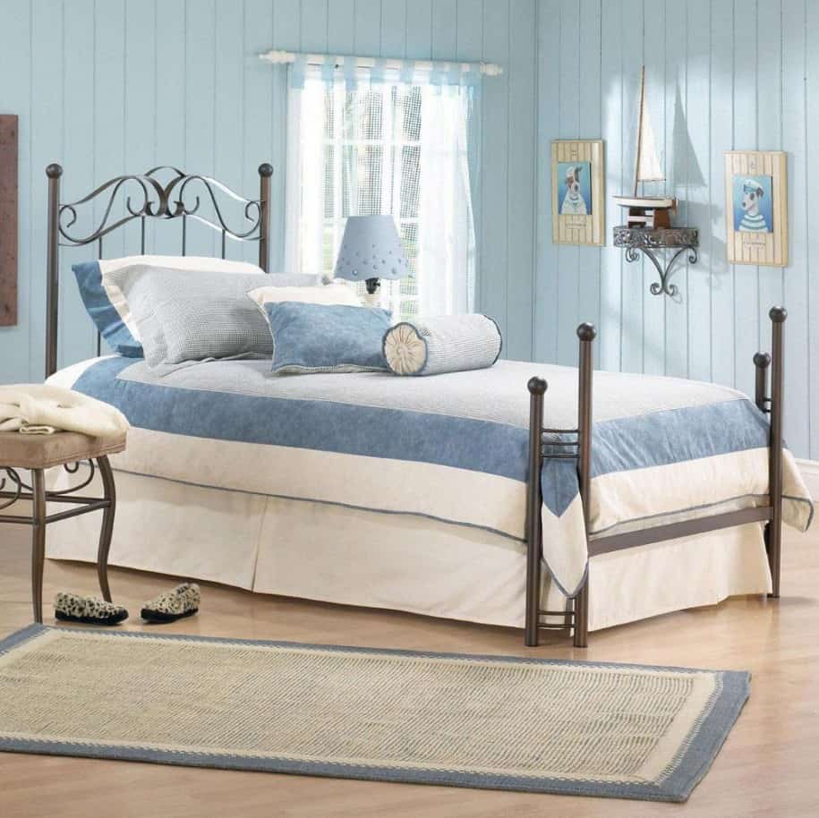 A soothing modern bedroom with light blue accent. This room uses pleasant light wood as flooring.